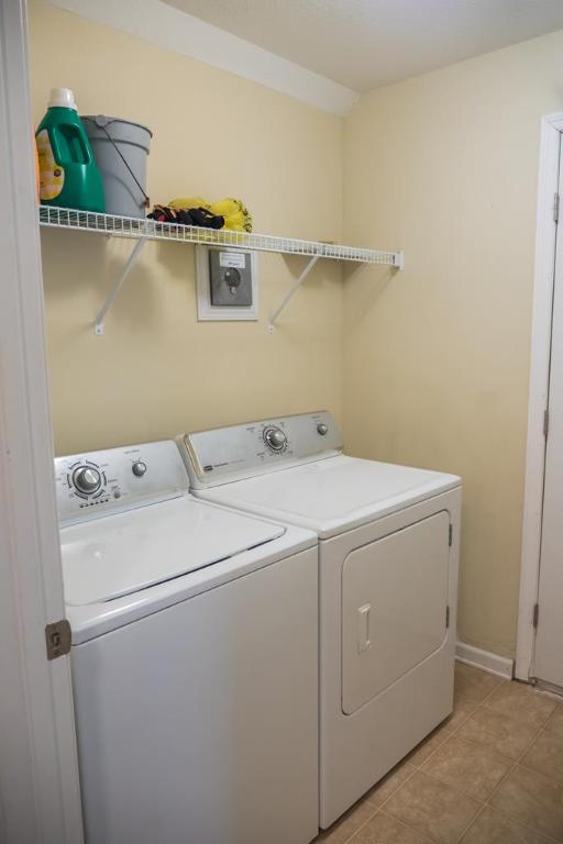 111 Covington Pointe Drive Brunswick, GA 31523 - Photo 24 of 29 Laundry upstairs with walk-in attic access