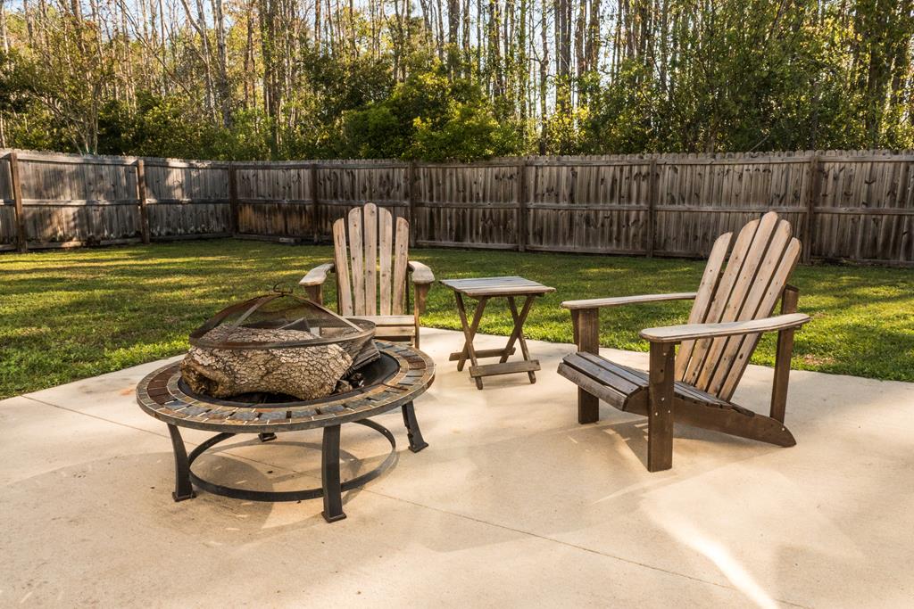 111 Covington Pointe Drive Brunswick, GA 31523 - Photo 26 of 29 Fire pit area in backyard.
