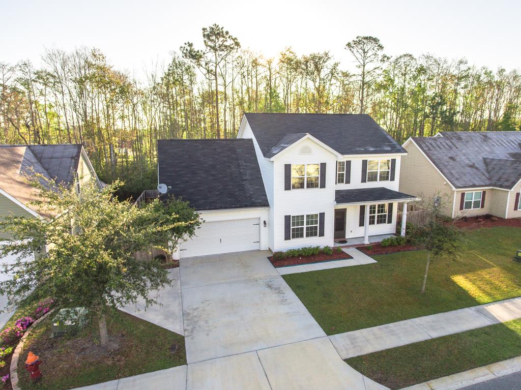 111 Covington Pointe Drive Brunswick, GA 31523 - Photo 29 of 29 Front elevation with nicely placed trees and lands