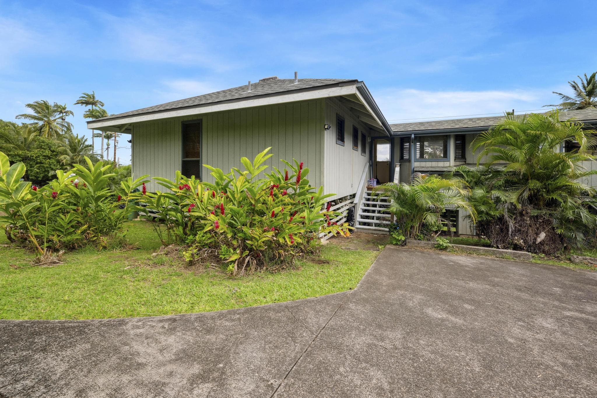 4950 Uakea Road Hana, HI 96713 - Photo 17 of 39 a front view of a house with garden