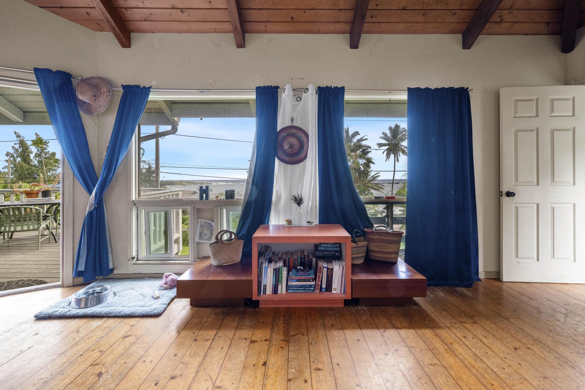 4950 Uakea Road Hana, HI 96713 - Photo 19 of 39 a living room with furniture and a wooden floor