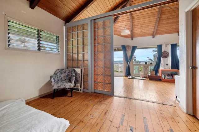 a bedroom with a bed and a couch