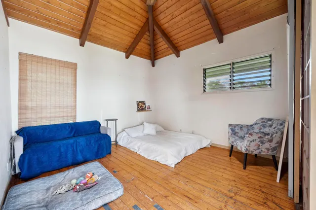 a kitchen with stainless steel appliances granite countertop a stove a sink and a microwave oven with cabinets