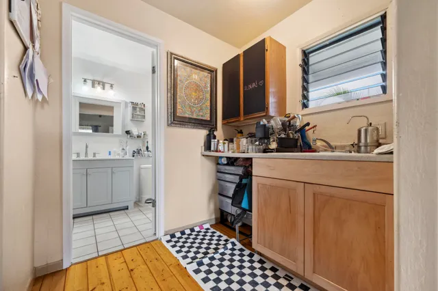 a bathroom with a sink a toilet and a shower