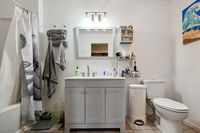 a living room with lots of furniture and a flat screen tv