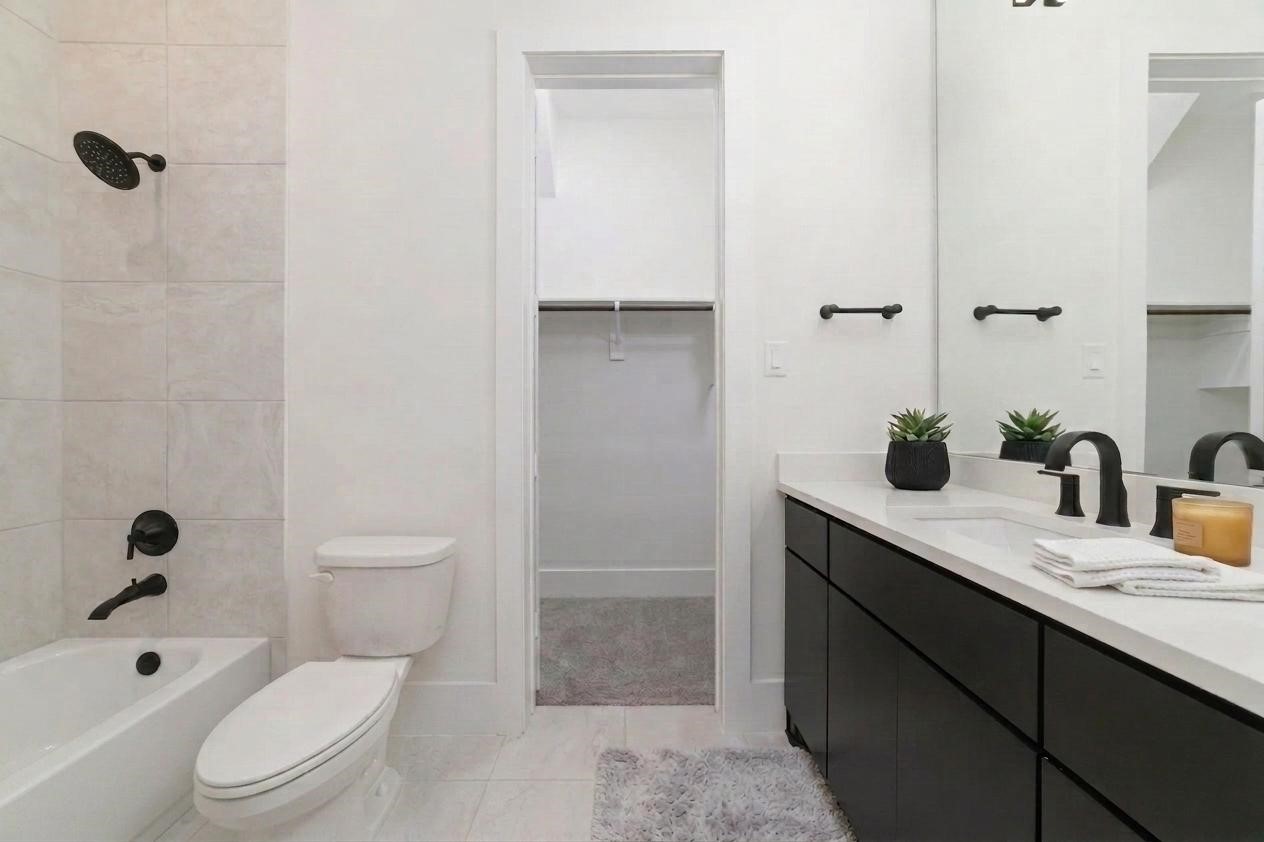 29627 Cir S Rnch Trail Fulshear, TX 77406 - Photo 27 of 50 Every secondary bathroom carries the same elevated finishes and thoughtful design found throughout the rest of the home because every guest deserves a beautiful space.