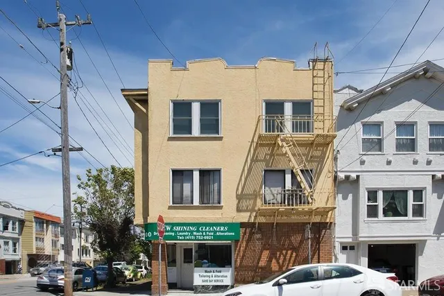 a front view of a building with a street