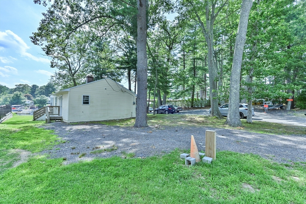23 Lakeview Road Webster, MA 01570 - Photo 15 of 35 a backyard of a house with plants and trees