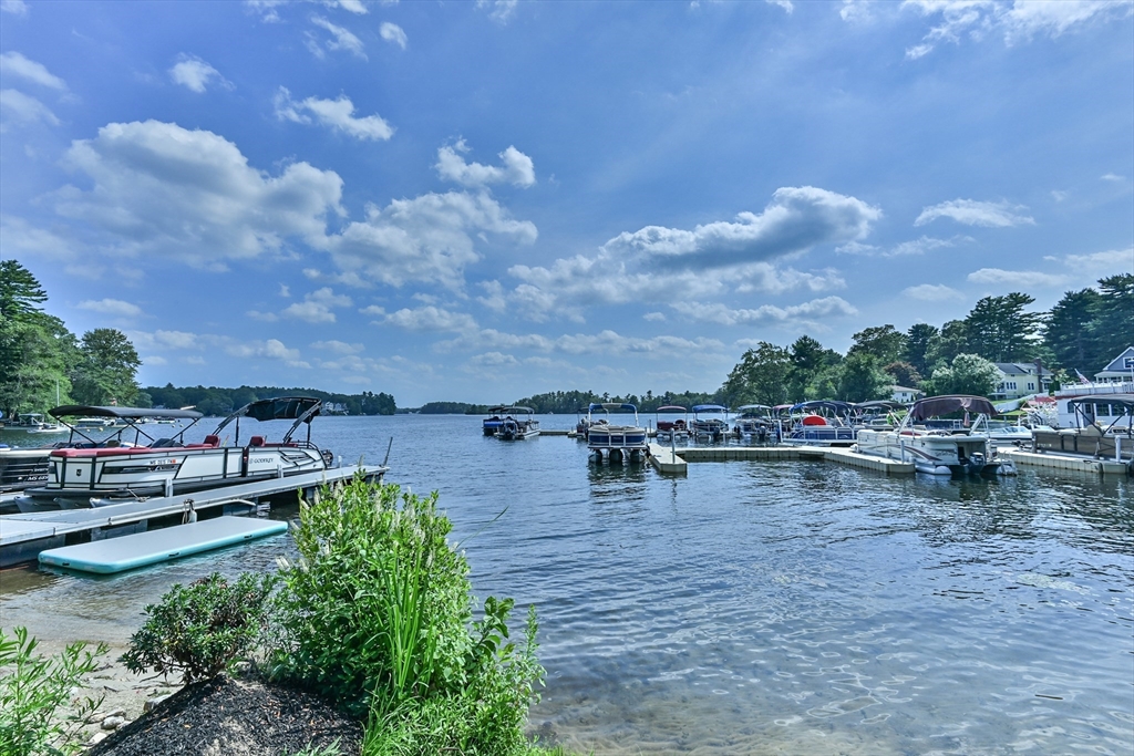 23 Lakeview Road Webster, MA 01570 - Photo 2 of 35 a view of a lake with sitting area