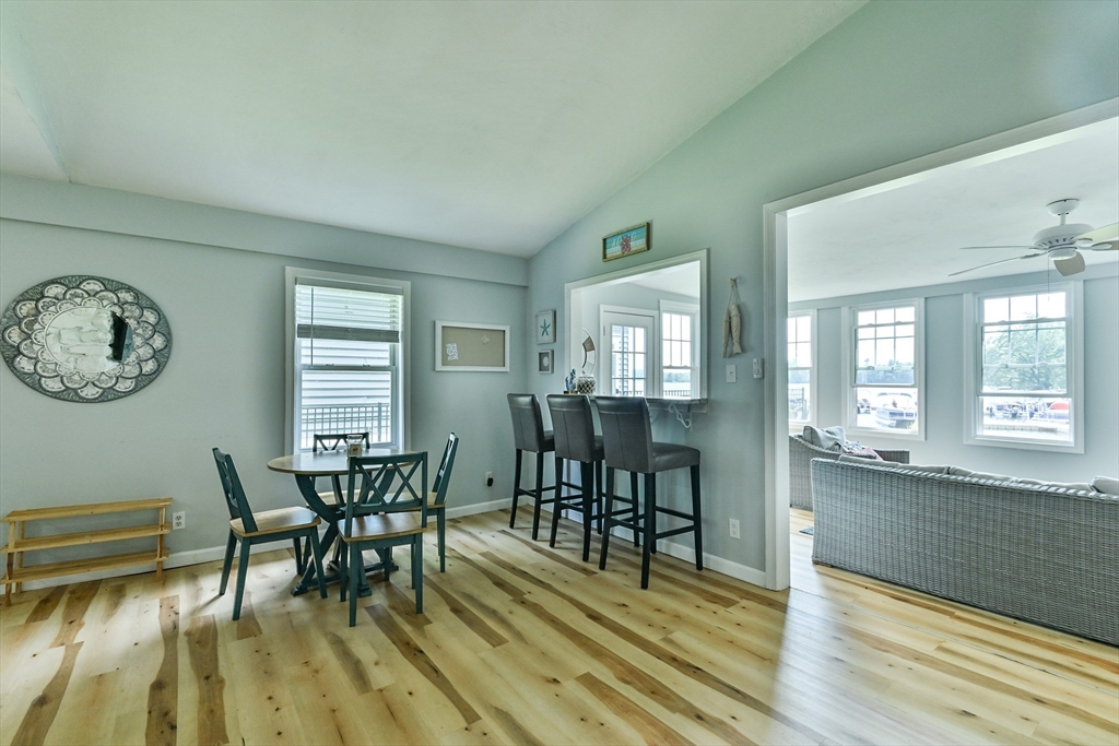 23 Lakeview Road Webster, MA 01570 - Photo 23 of 35 a view of a dining room with furniture and wooden floor