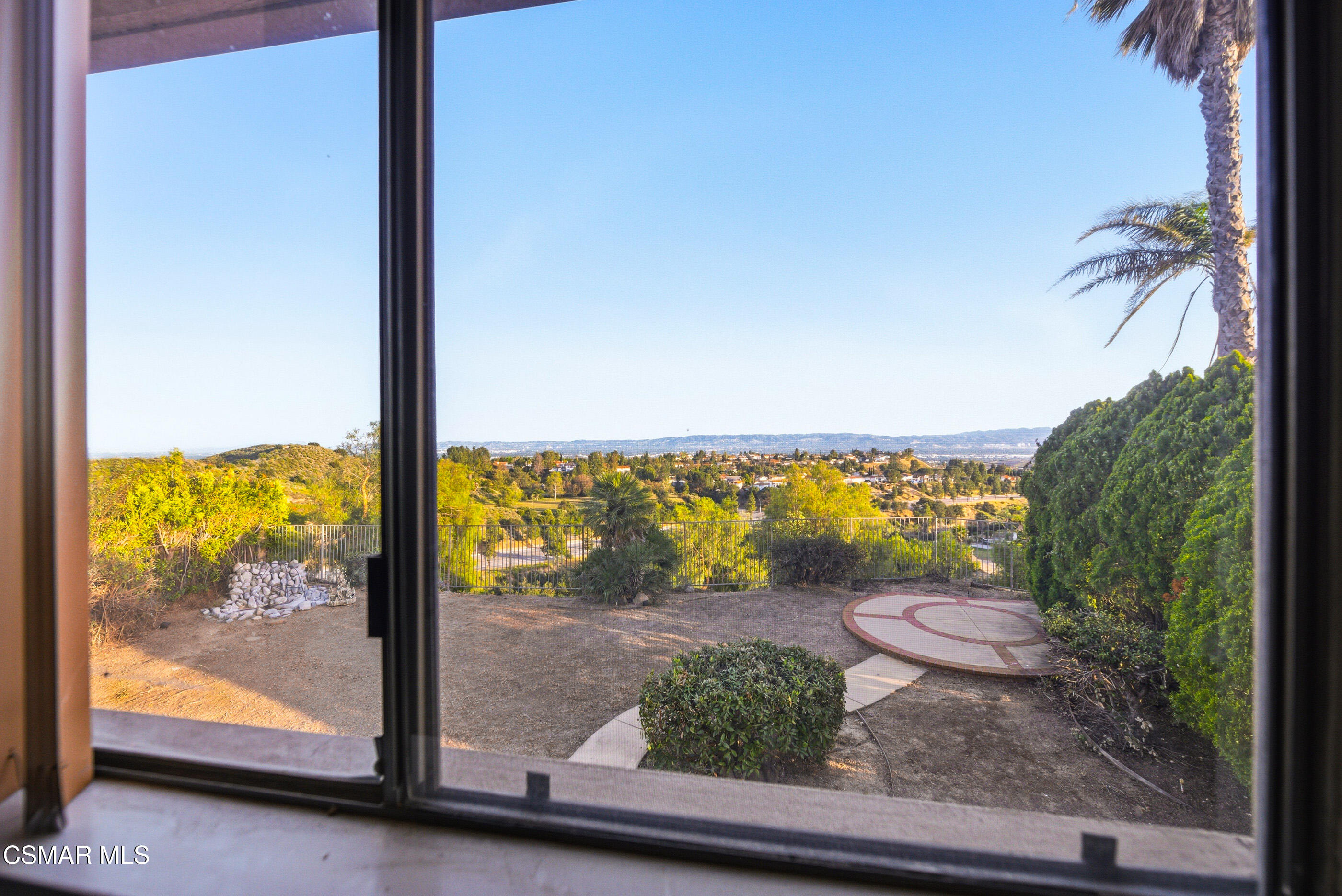 12036 Shadow Ridge Way Porter Ranch, CA 91326 - Photo 24 of 35 a view of a room with wooden floor and a bench