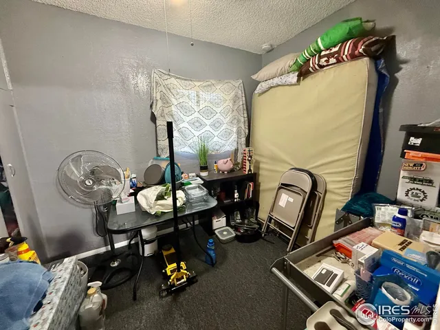 a view of a workspace with furniture and toys