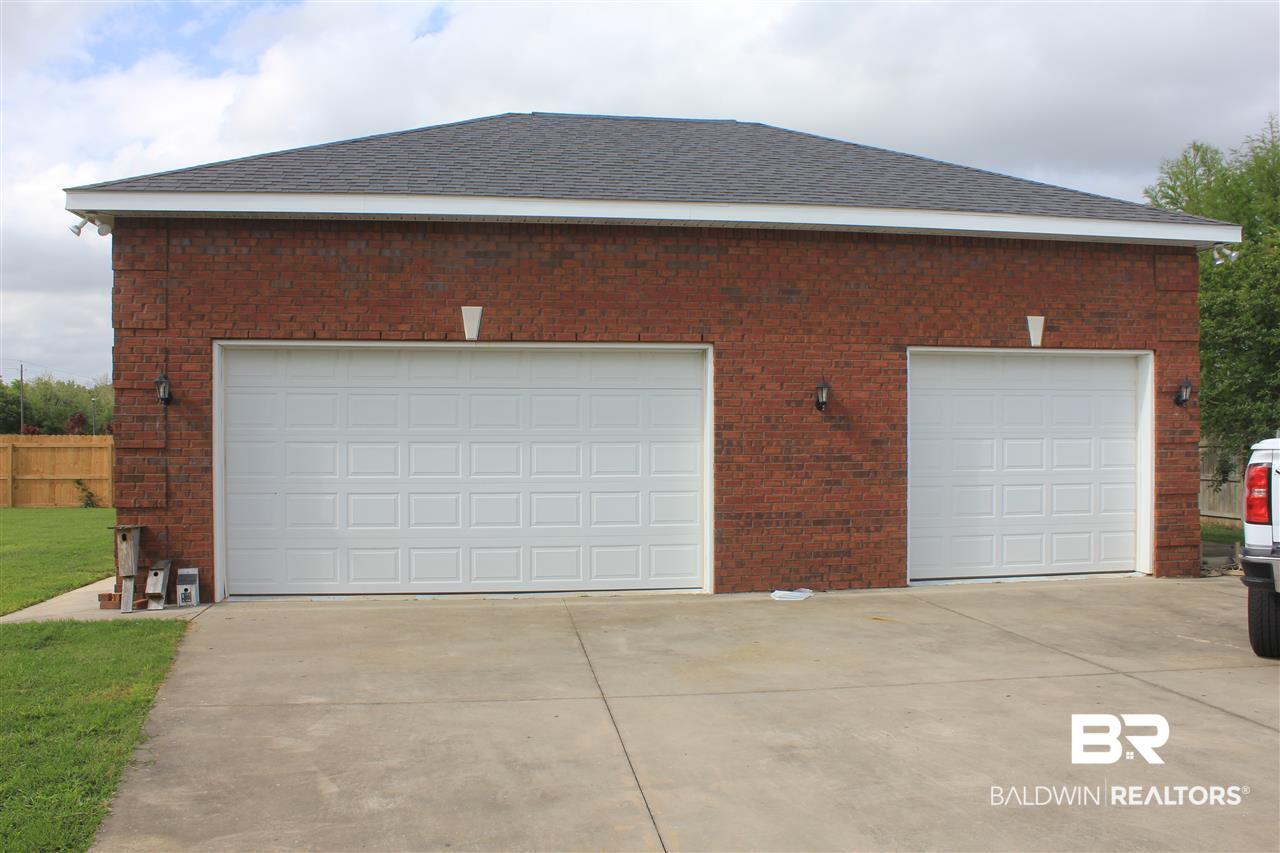 583 Park Avenue Foley, AL 36535 - Photo 21 of 25 3 Car Garage with 1/2 Bath w/hot water. Stairs