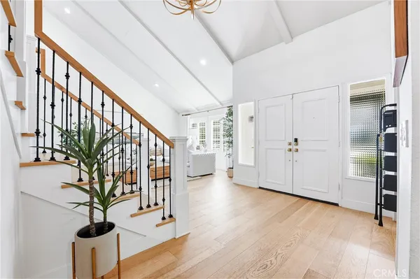a view of an entryway with wooden floor