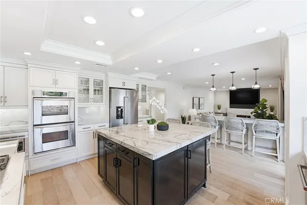 a view of kitchen with sink microwave and refrigerator