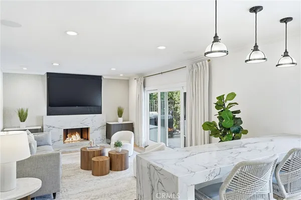 a living room with fireplace furniture and a flat screen tv