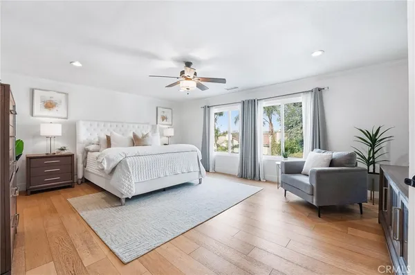 a bedroom with a bed and a couch