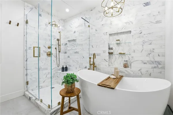 a bathroom with a bathtub and a shower