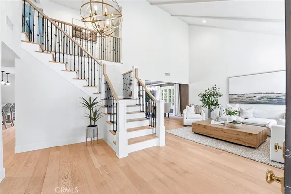a view of a room with wooden floor and stairs