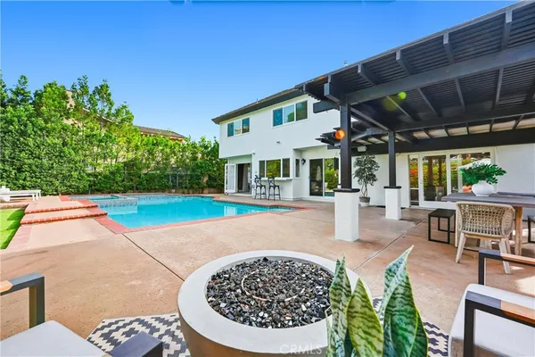a view of a chairs and table in the patio