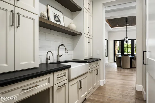 a bedroom with furniture and a large window