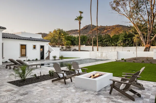 a kitchen with stainless steel appliances granite countertop a sink and cabinets