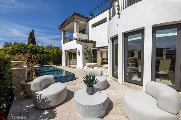 a view of a patio with couches table and chairs