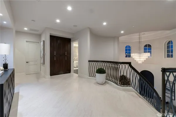 a bedroom with a large bed and a large window