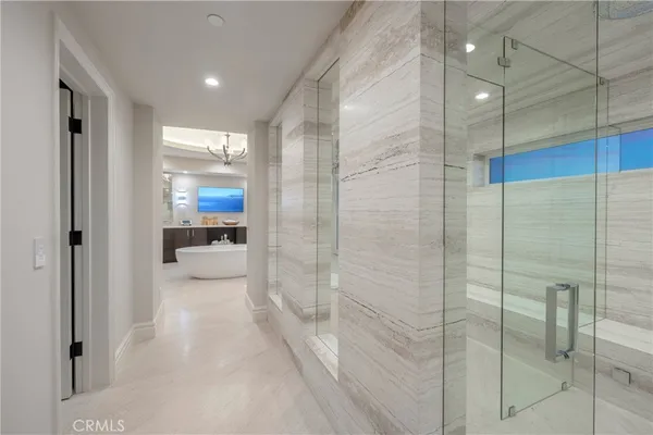 a large kitchen with a large counter top appliances and cabinets