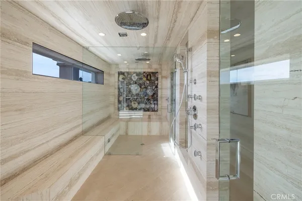 a view of a lobby with furniture and a glass door
