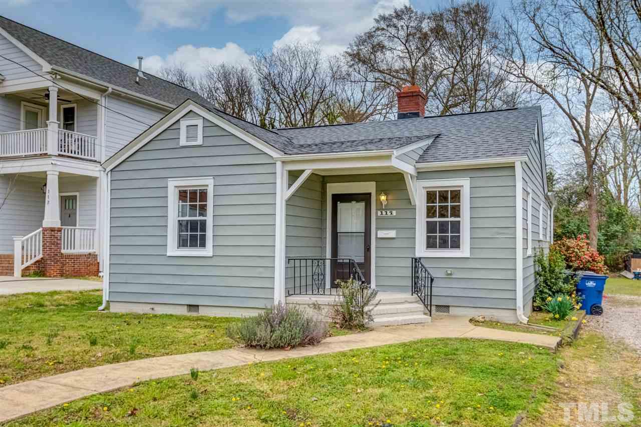 119 South Pettigrew Street Raleigh, NC 27610 - Photo 2 of 30 a front view of a house with a yard and garage