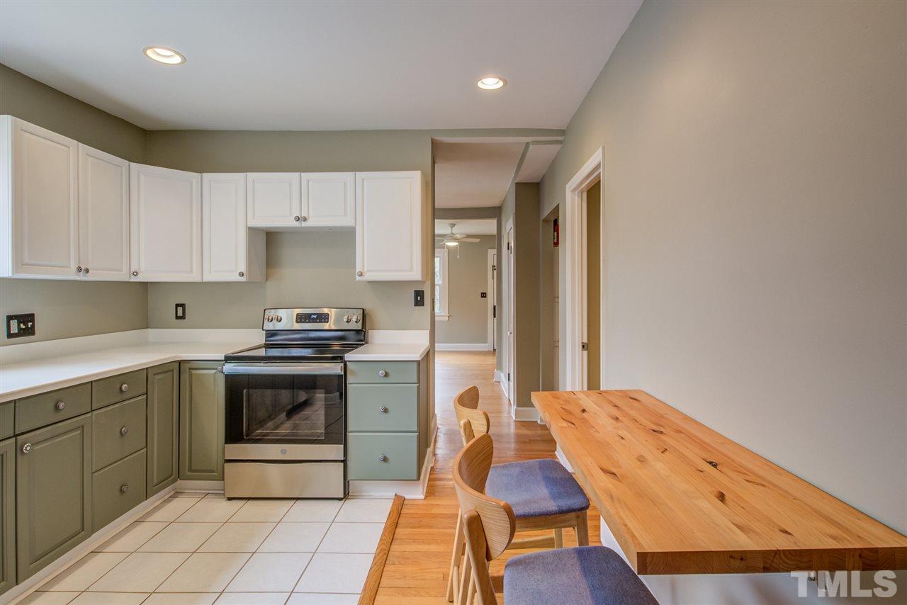 119 South Pettigrew Street Raleigh, NC 27610 - Photo 13 of 30 a kitchen with a sink and cabinets