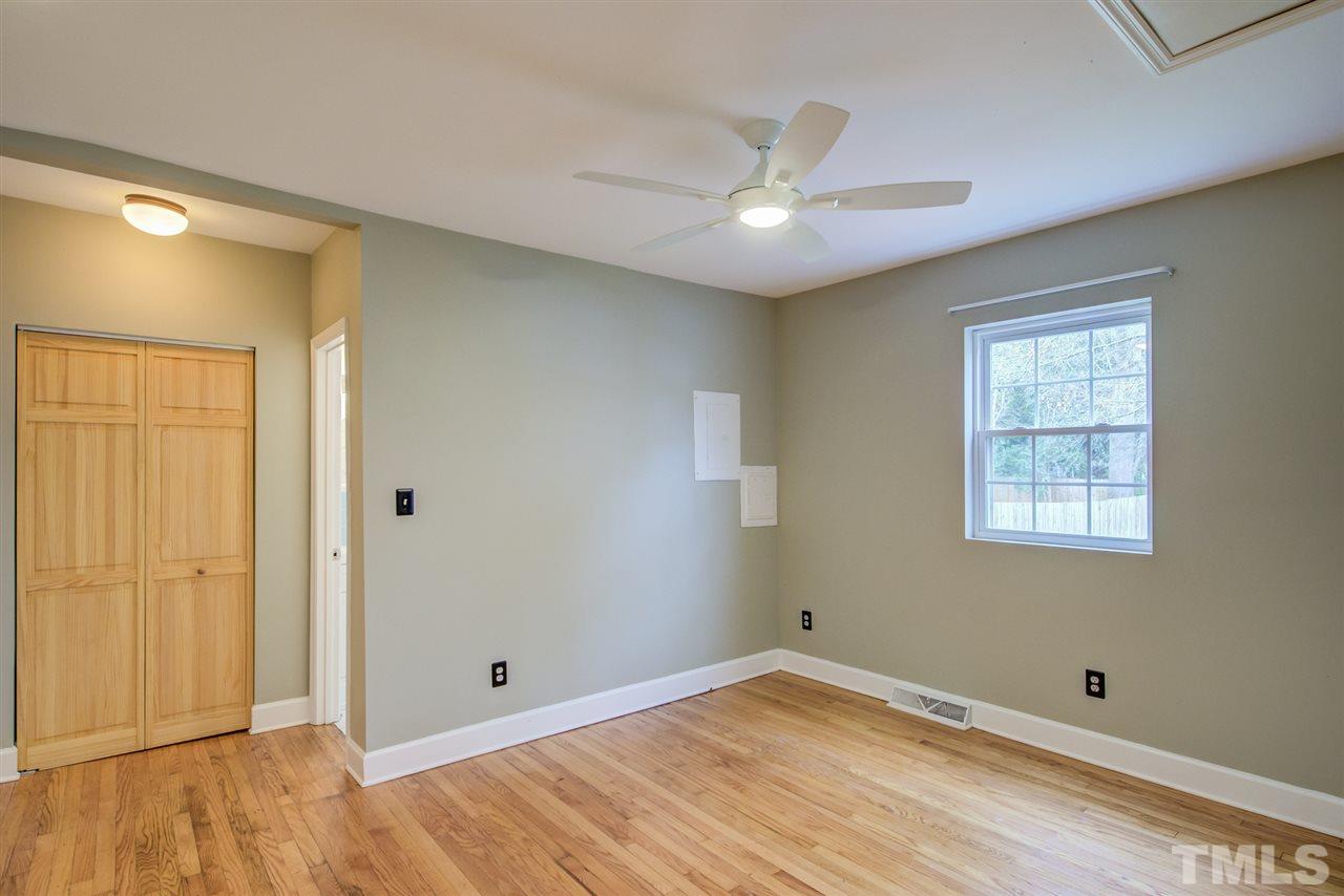 119 South Pettigrew Street Raleigh, NC 27610 - Photo 17 of 30 a view of empty room with wooden floor and fan