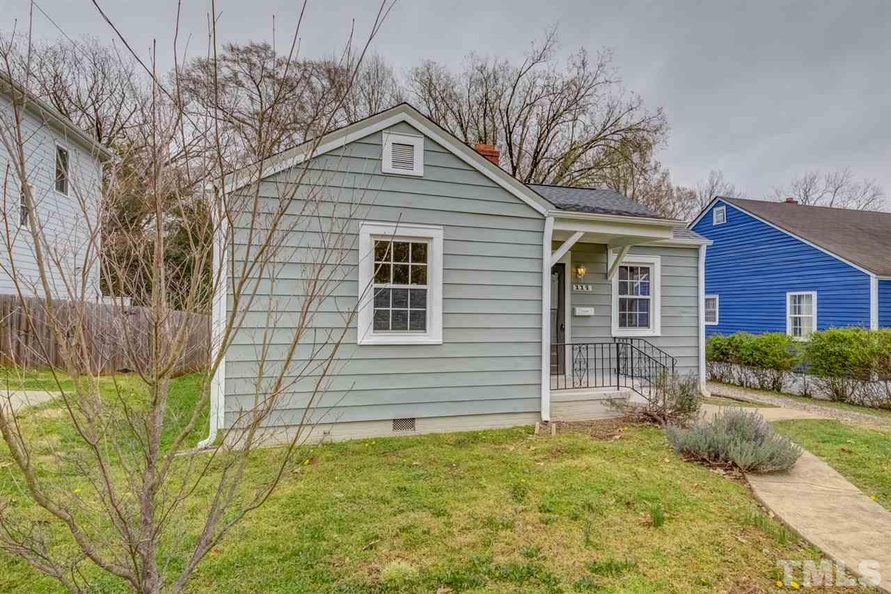 119 South Pettigrew Street Raleigh, NC 27610 - Photo 3 of 30 a front view of a house with a yard