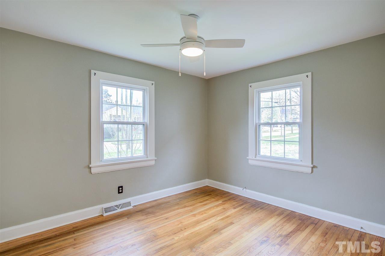 119 South Pettigrew Street Raleigh, NC 27610 - Photo 21 of 30 a view of an empty room with wooden floor and a window