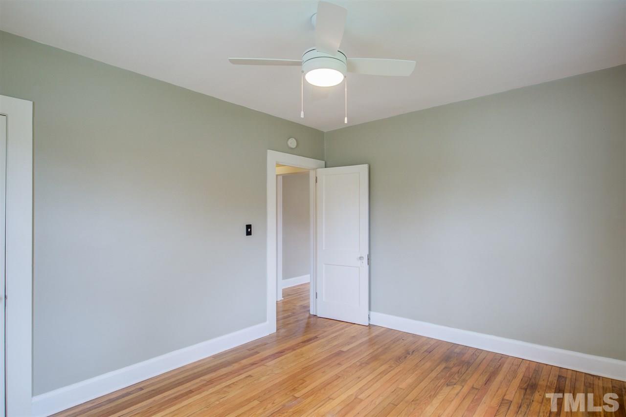 119 South Pettigrew Street Raleigh, NC 27610 - Photo 22 of 30 a view of an empty room with wooden floor