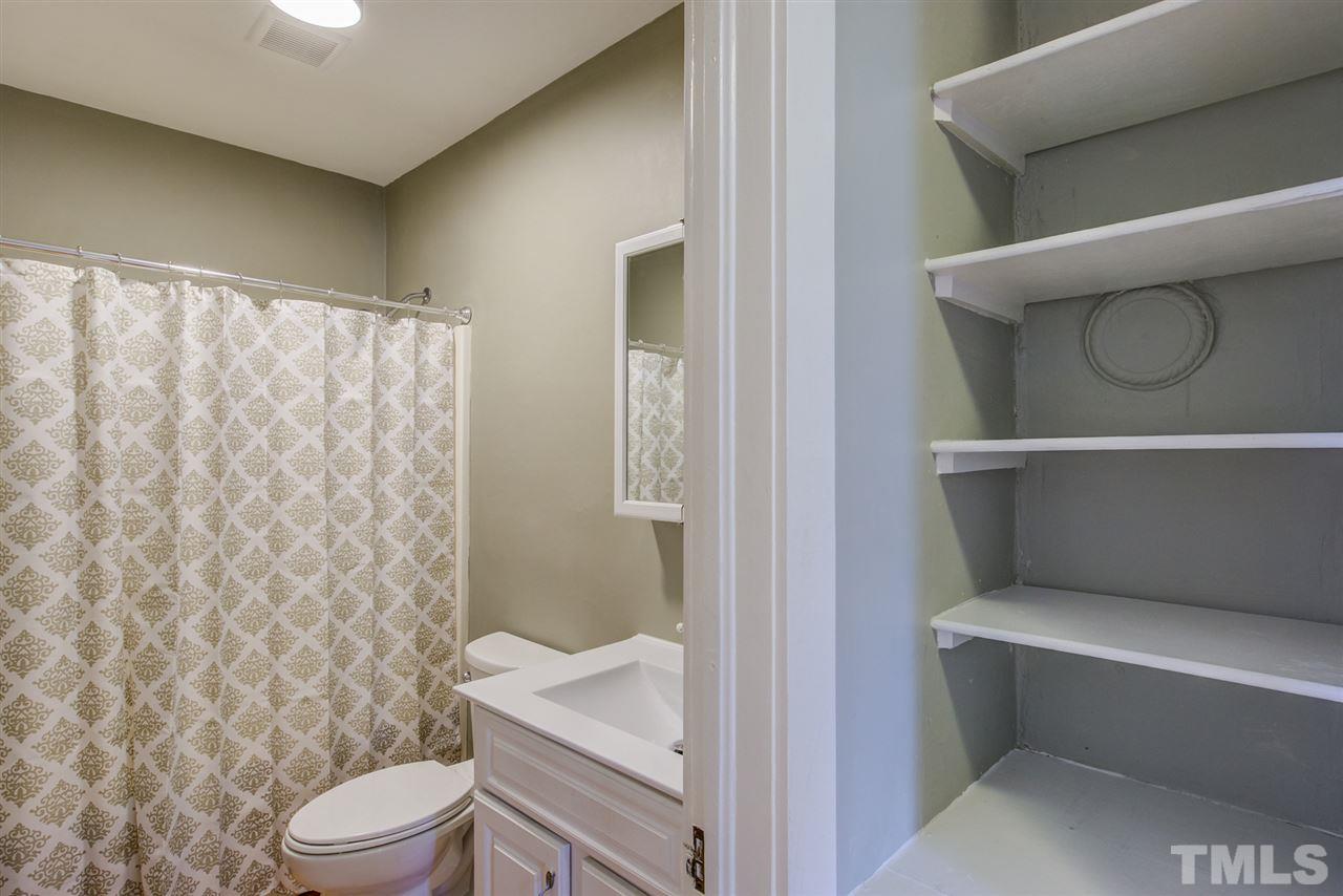 119 South Pettigrew Street Raleigh, NC 27610 - Photo 24 of 30 a bathroom with a toilet and a shower