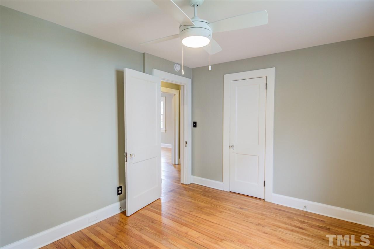 119 South Pettigrew Street Raleigh, NC 27610 - Photo 26 of 30 wooden floor in an empty room with a window