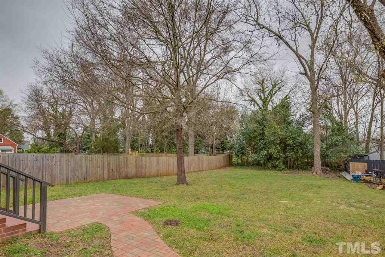 119 South Pettigrew Street Raleigh, NC 27610 - Photo 29 of 30 a view of a backyard with furniture and a tree