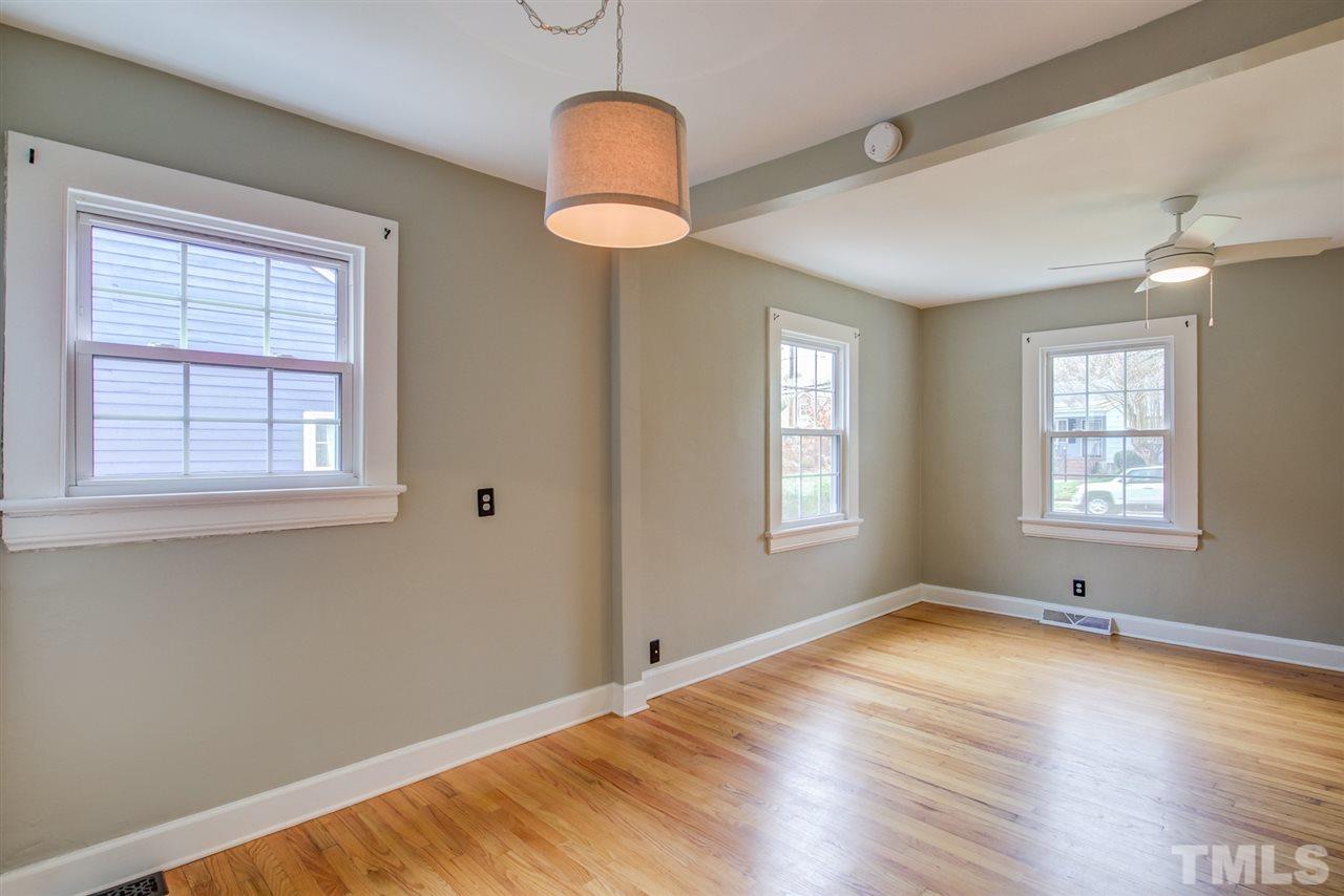 119 South Pettigrew Street Raleigh, NC 27610 - Photo 8 of 30 a view of empty room with wooden floor and fan
