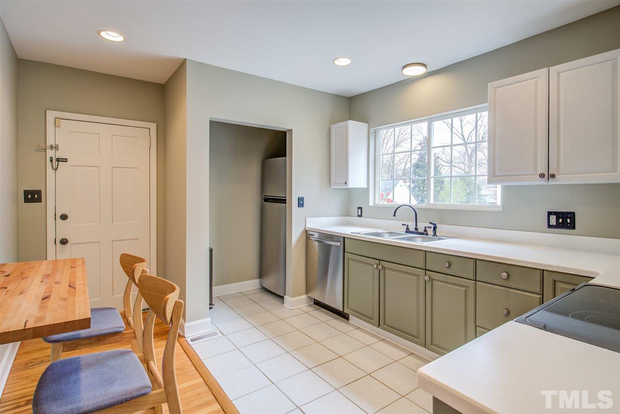 119 South Pettigrew Street Raleigh, NC 27610 - Photo 10 of 30 a kitchen with a sink cabinets and window
