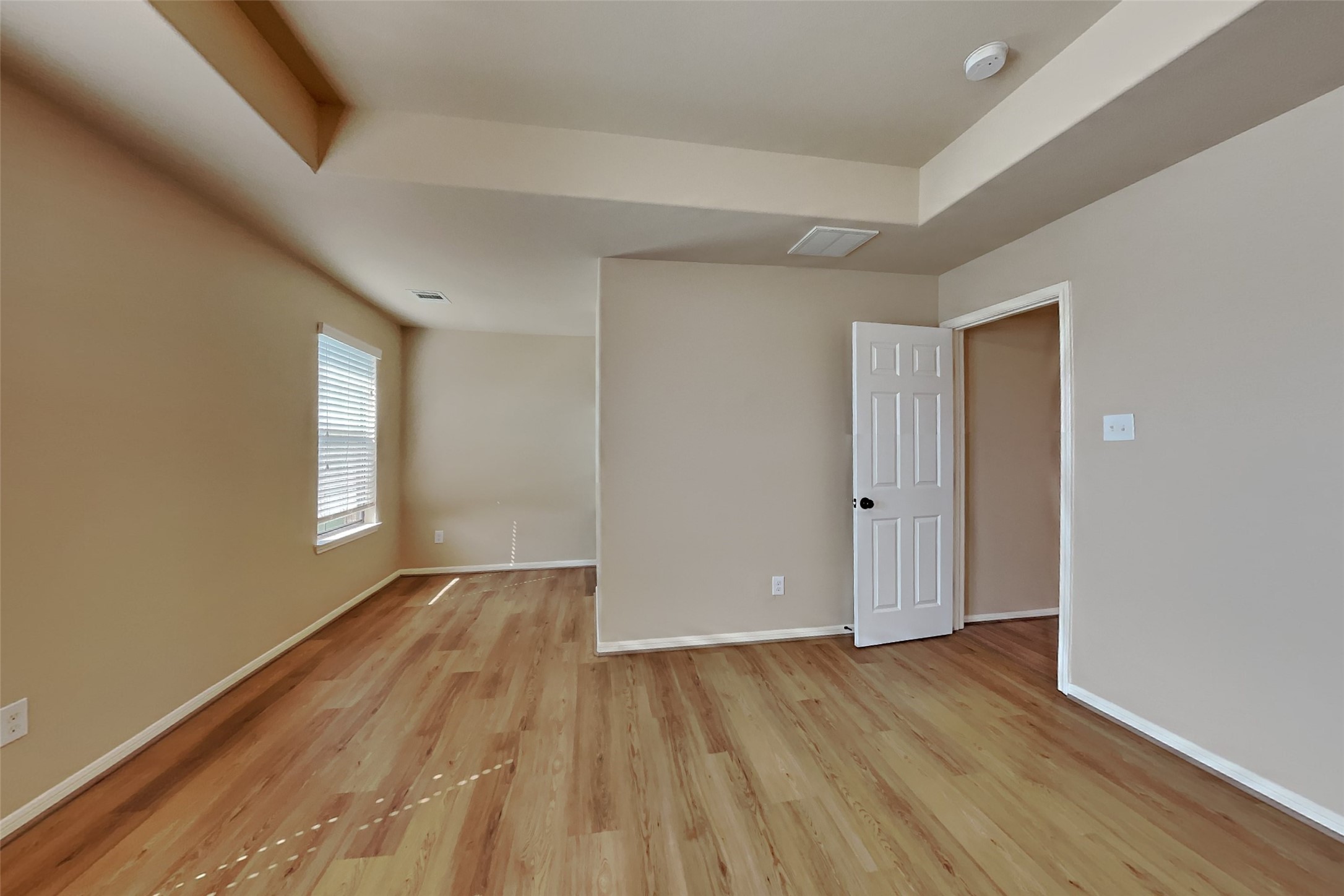 19715 Seabury Path Ct. Katy, TX 77449 - Photo 9 of 20 a view of an empty room with wooden floor and window