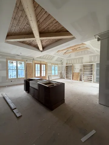 a view of empty room with a fireplace