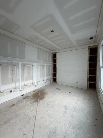 a view of empty room with a fireplace