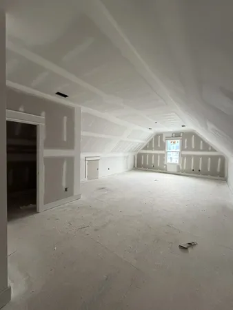 a view of empty room with a projector