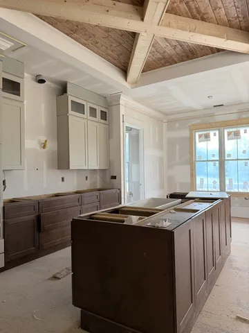 a kitchen with a sink and a stove top oven