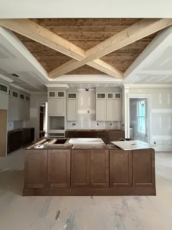 a kitchen with stainless steel appliances granite countertop a sink and cabinets