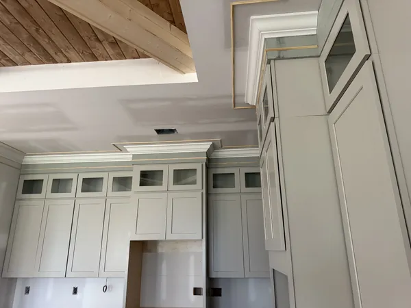 a large kitchen with kitchen island granite countertop a stove and a sink with dishwasher