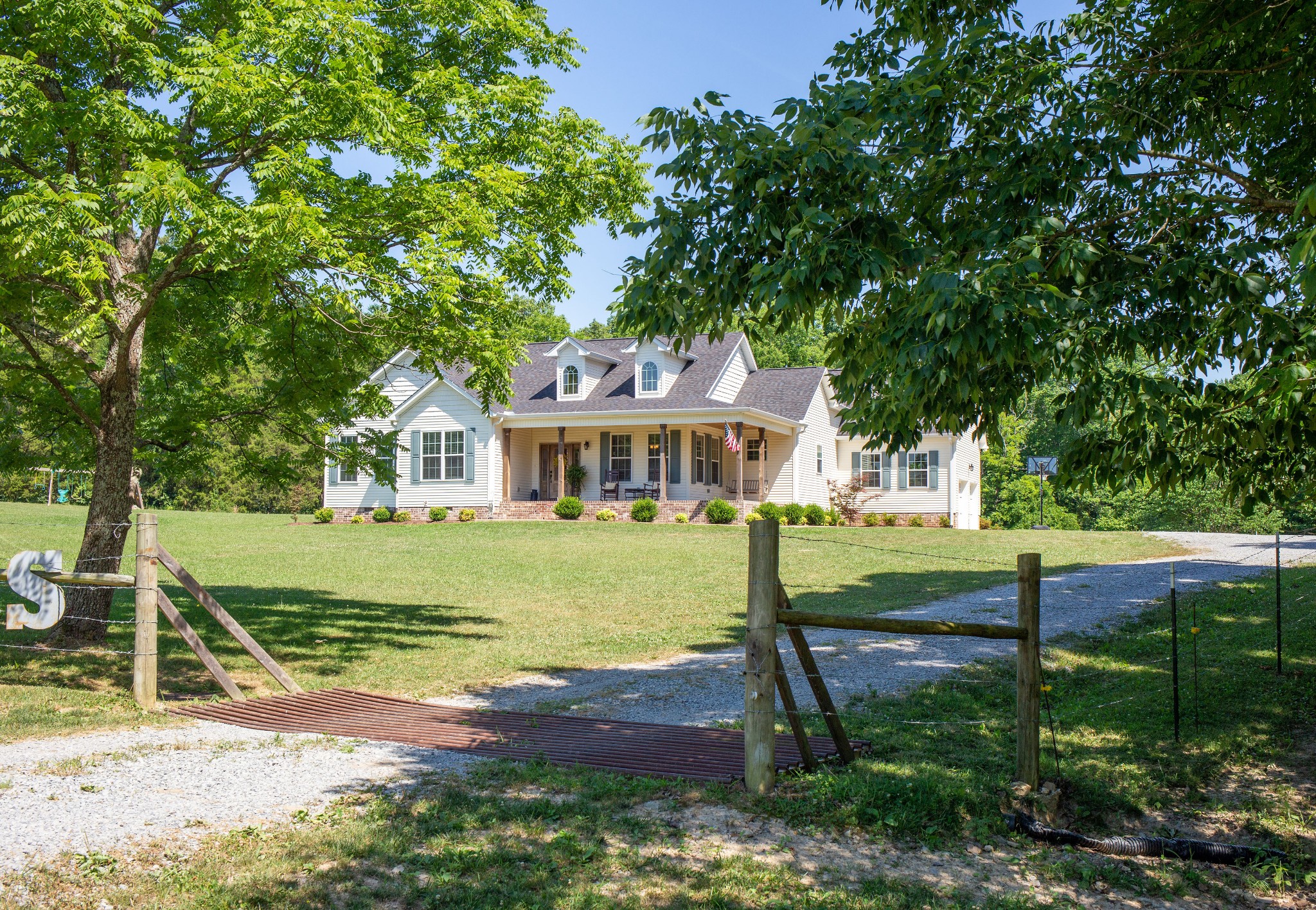 310 Freeland Road Portland, TN 37148 - Photo 1 of 31 a front view of a house with a garden