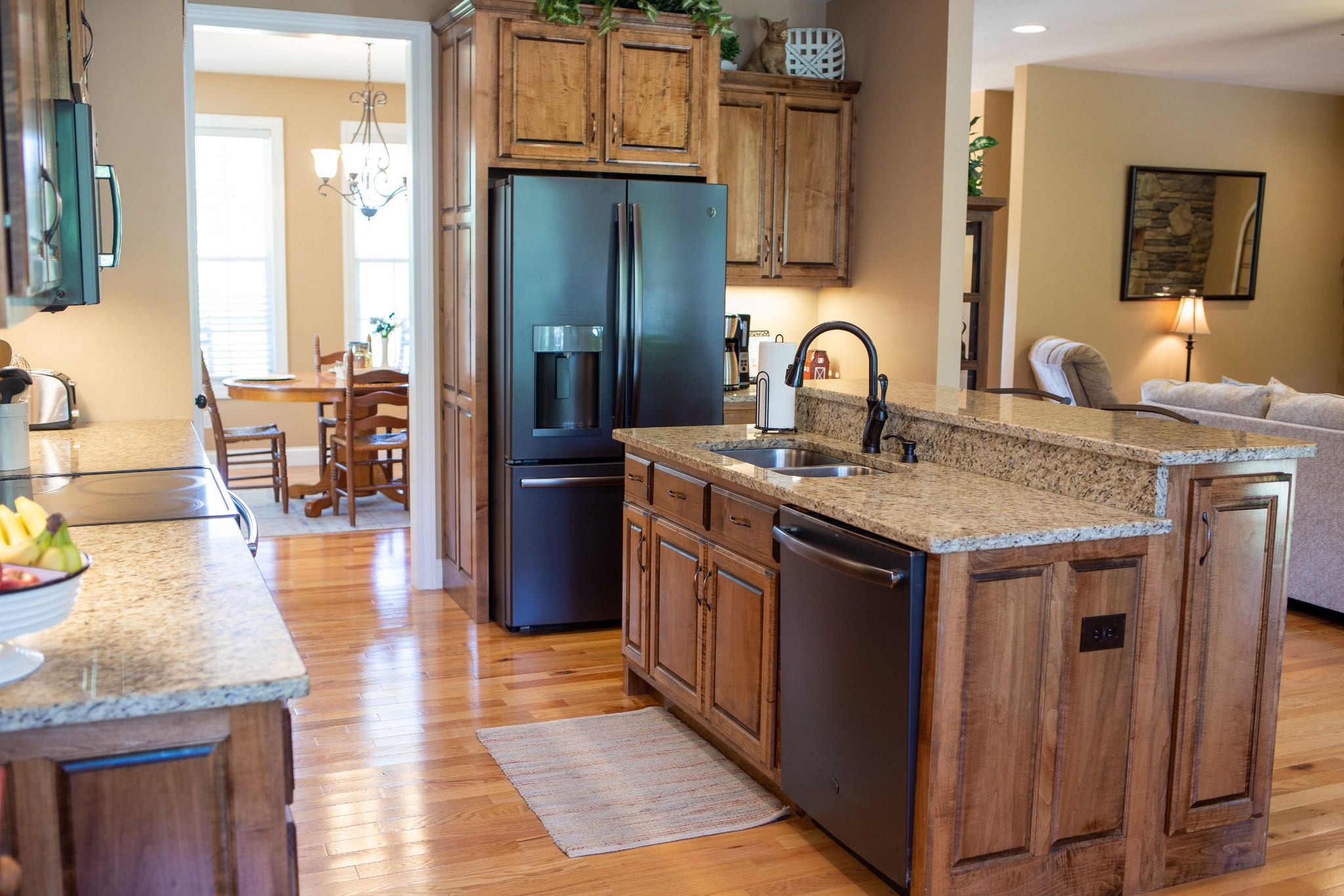 310 Freeland Road Portland, TN 37148 - Photo 16 of 31 a kitchen with stainless steel appliances granite countertop a stove and a wooden floors